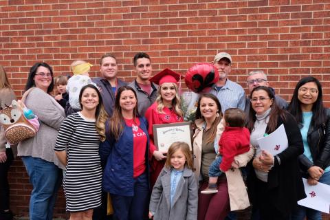 Bridgette Savoie stands with her family following her graduation from the University of Louisiana at Lafayette.