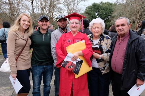 Vicki Vincent-Seaux stands with her daughter-in-law, two sons, mother, and husband following her graduation from the University of Louisiana at Lafayette.