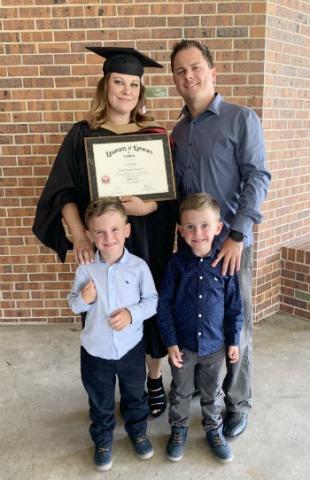 Jessica Griffin, MBA HCA, with her family following commencement ceremonies.
