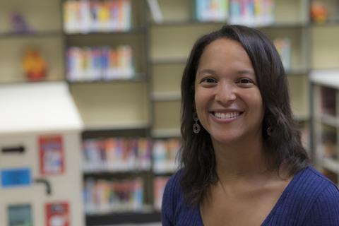 Dr. Jade Calais poses in Youngsville Middle School's school library.