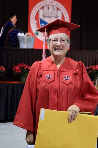 Vicki Vincent-Seaux holds her degree after 40 years.
