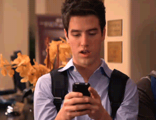 Gif of man searching on his phone and then pointing to the screen